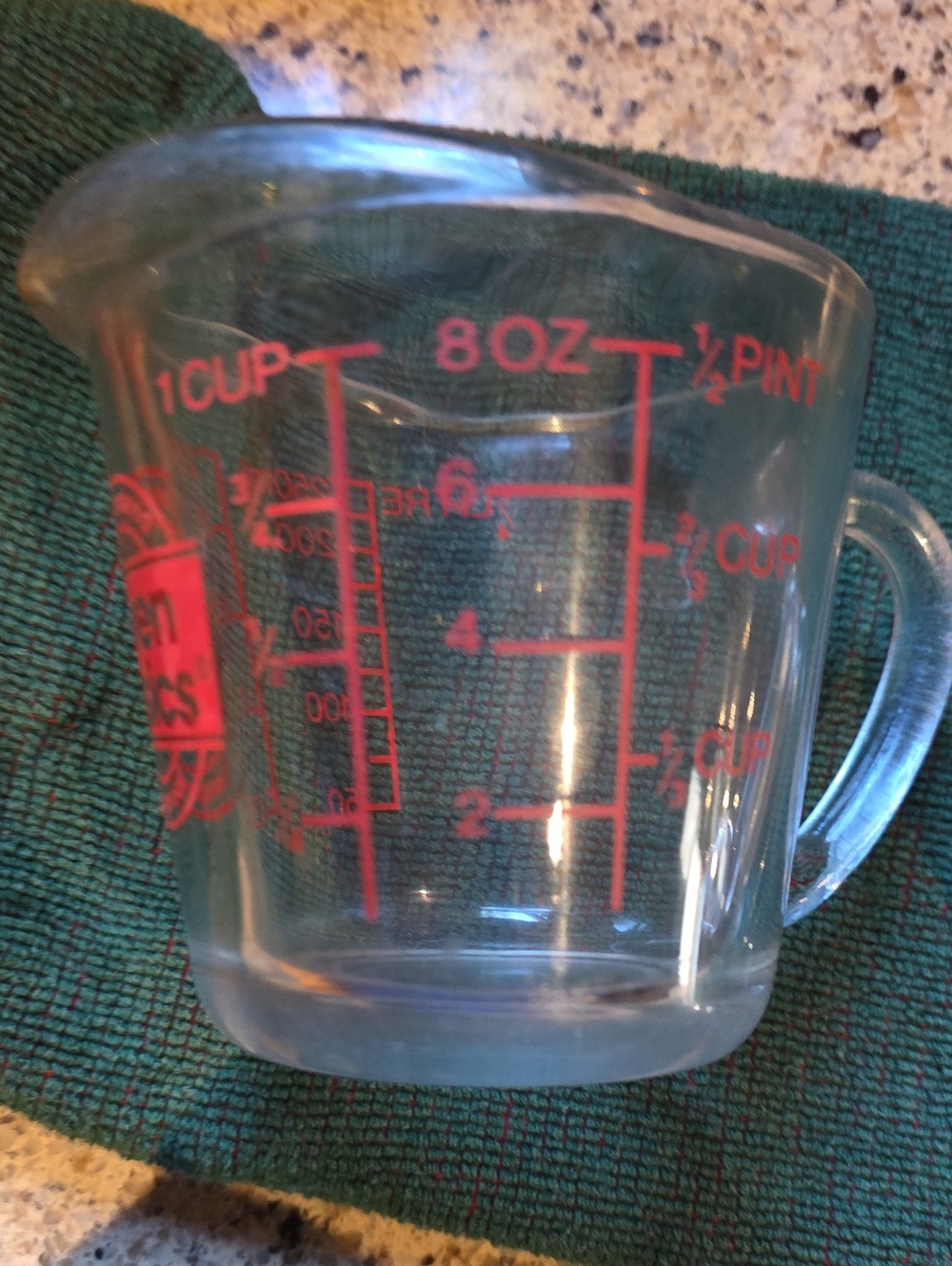 Clear Glass Measuring Cup with Red Measurement Markings